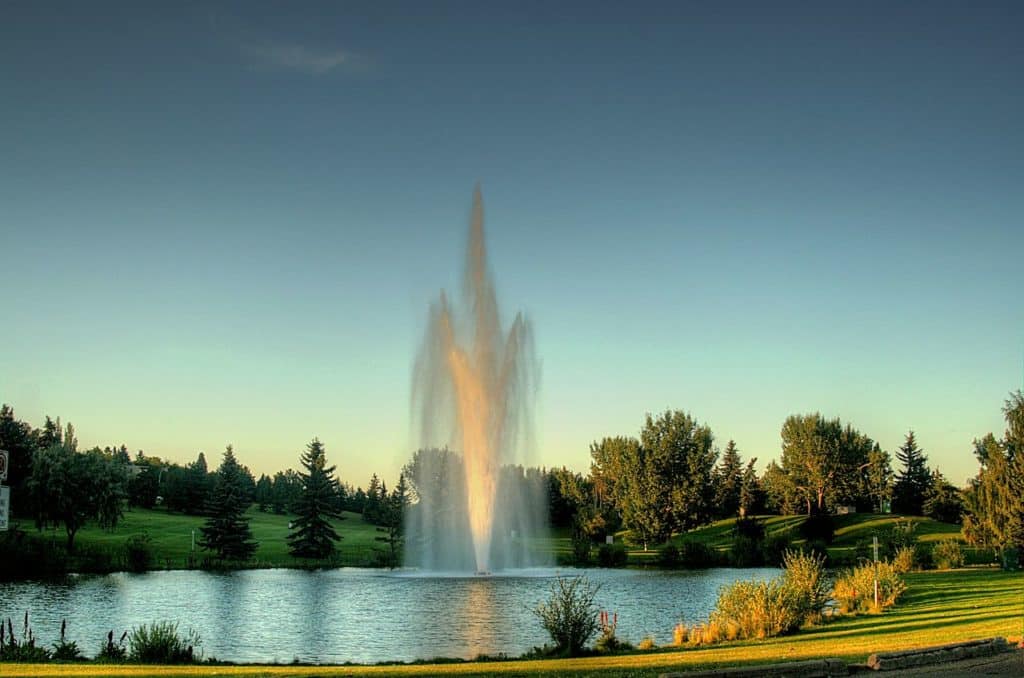 A large fountain in a pond at Rundle Park.