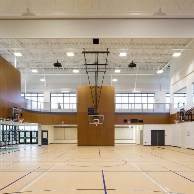 Basketball hoops inside the gym of the Dr. Anne Anderson High School in Desrochers Villages.